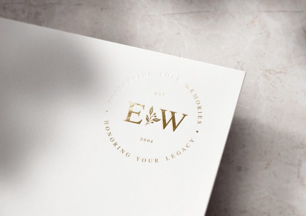 A logo monogram in gold foil for luxury wedding videographers based on the Castella premade brand kit.