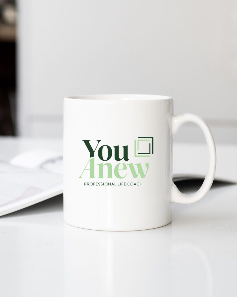 YouAnew life coach branding and logo design on coffee mug